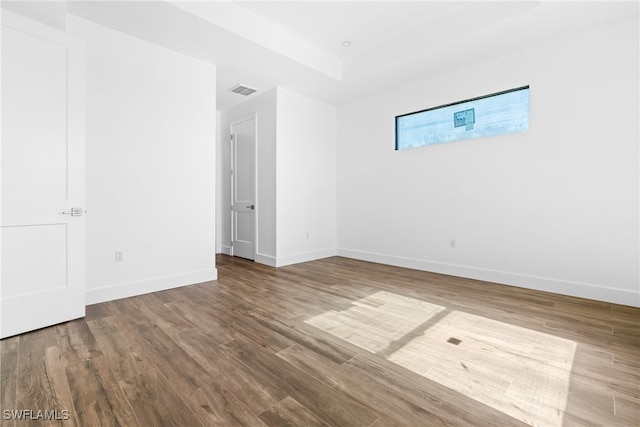 unfurnished room with hardwood / wood-style floors