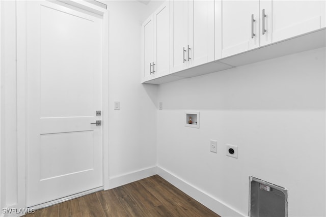 laundry area with hookup for an electric dryer, dark hardwood / wood-style floors, cabinets, and washer hookup