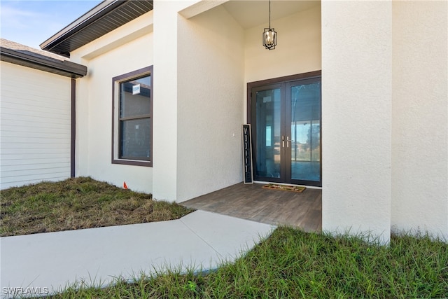 property entrance featuring french doors