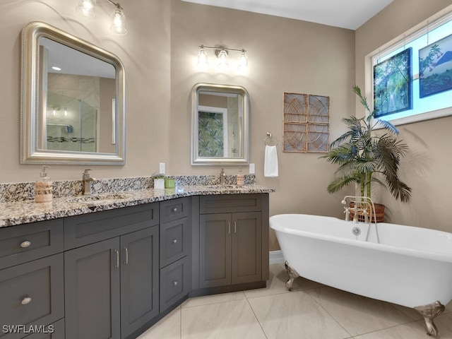 bathroom featuring tile patterned floors, vanity, and separate shower and tub