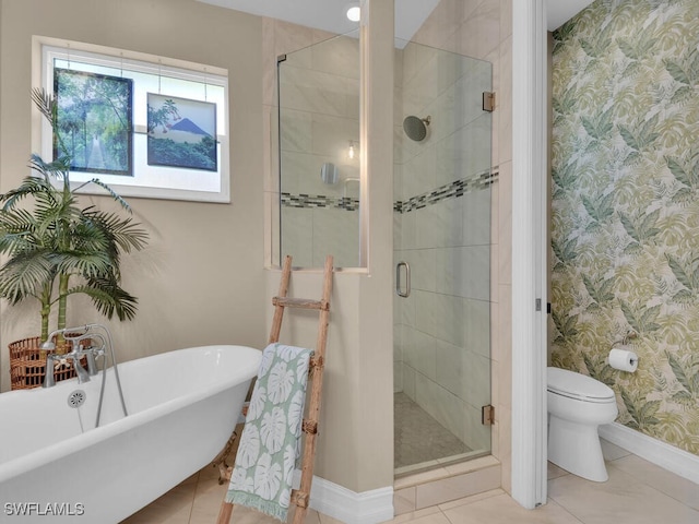 bathroom with tile patterned flooring, separate shower and tub, and toilet