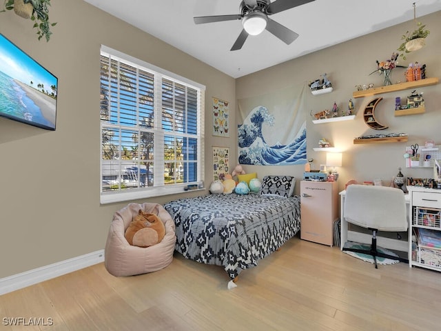 bedroom with hardwood / wood-style floors and ceiling fan