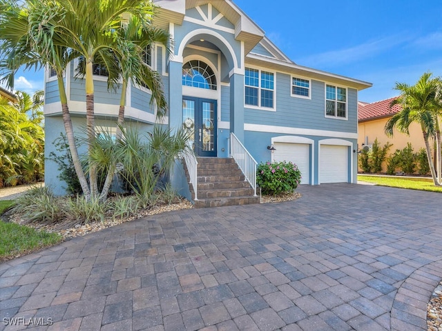 view of front of house with french doors and a garage