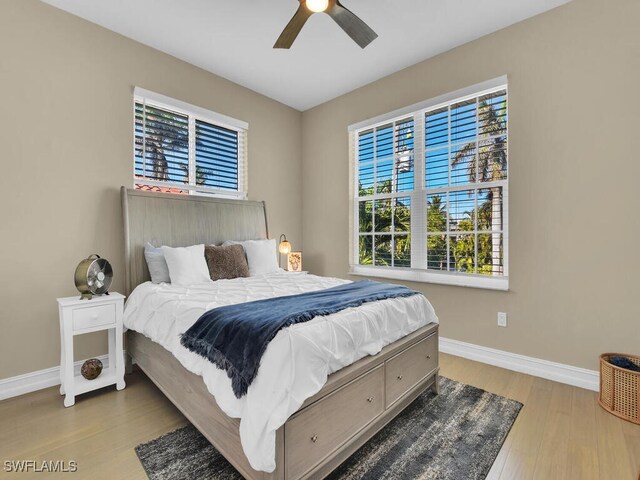 bedroom featuring ceiling fan and light hardwood / wood-style floors