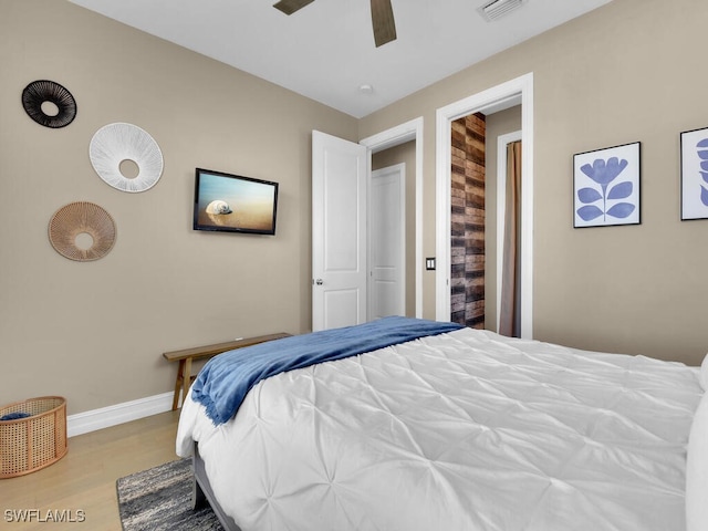 bedroom with ceiling fan and light wood-type flooring