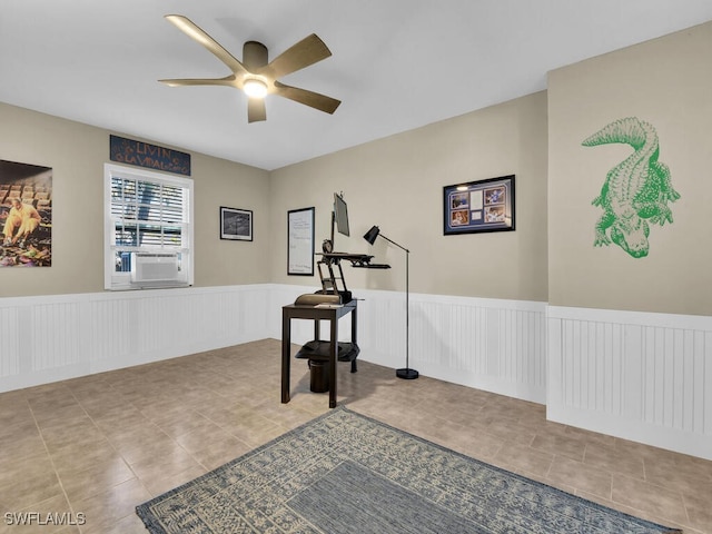 exercise room with ceiling fan