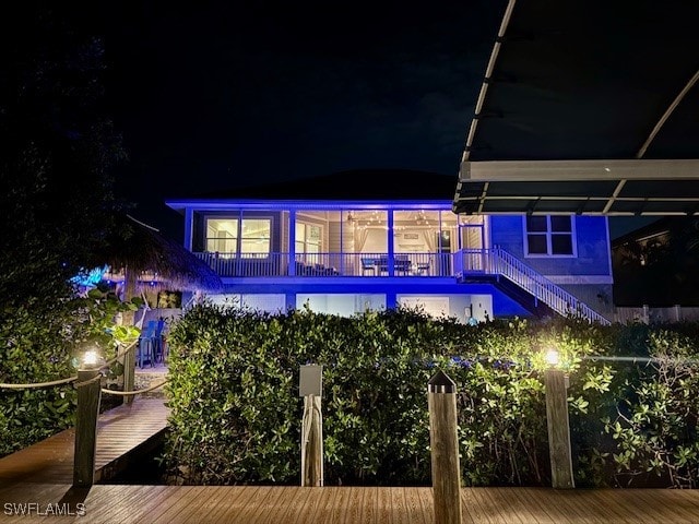 view of back house at twilight