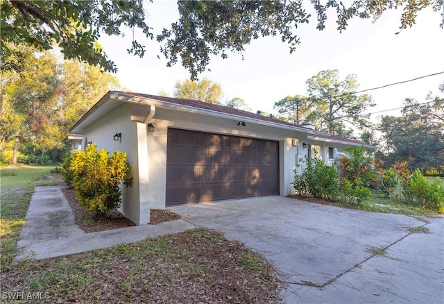 view of side of property with a garage