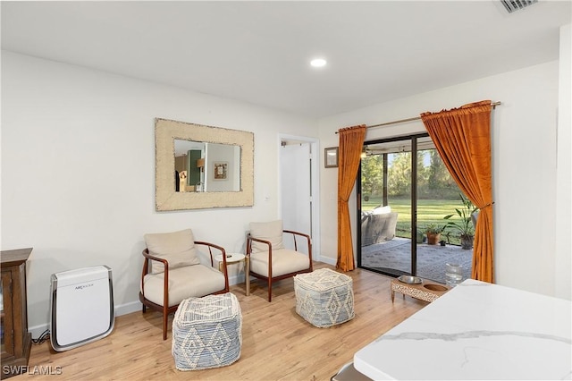 sitting room featuring light hardwood / wood-style floors