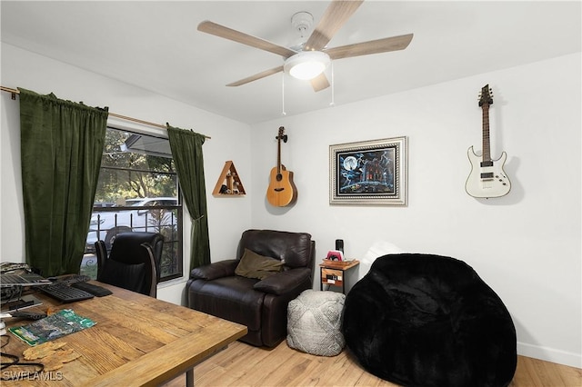 office area with hardwood / wood-style flooring and ceiling fan