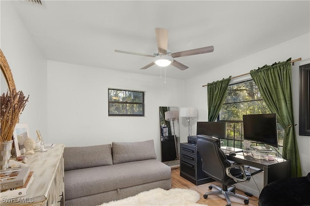 office area featuring light hardwood / wood-style flooring and ceiling fan