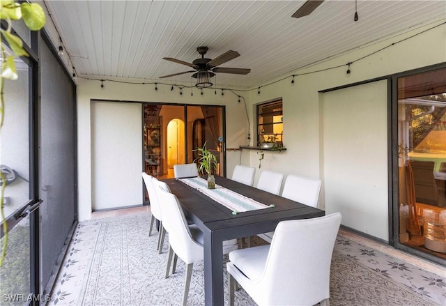 dining area with ceiling fan and wooden ceiling