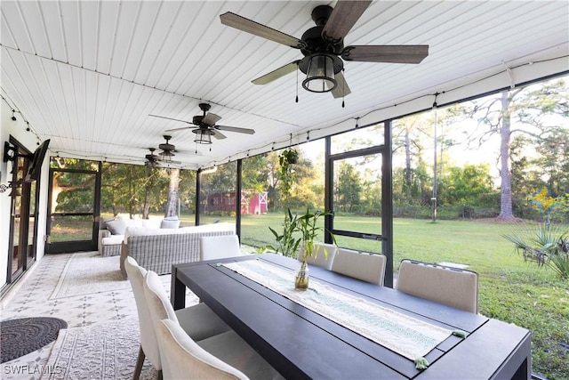 sunroom / solarium with ceiling fan and wooden ceiling