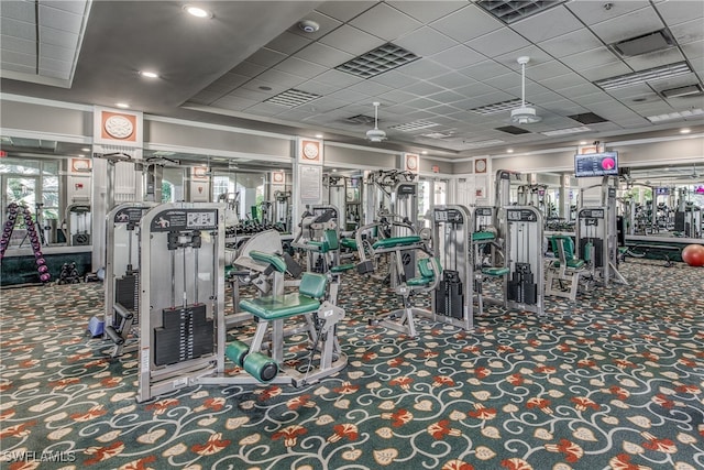 gym with carpet floors and ornamental molding