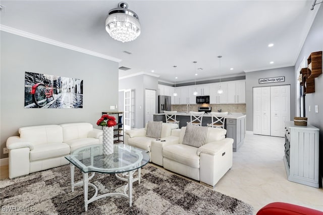 1350 Triandra Ln, Naples, FL 34119 - living area featuring recessed lighting, ornamental molding, and a chandelier