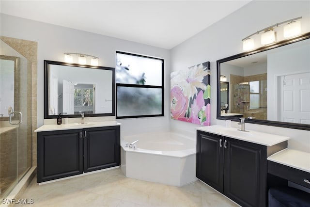 bathroom featuring vanity, tile patterned flooring, and plus walk in shower