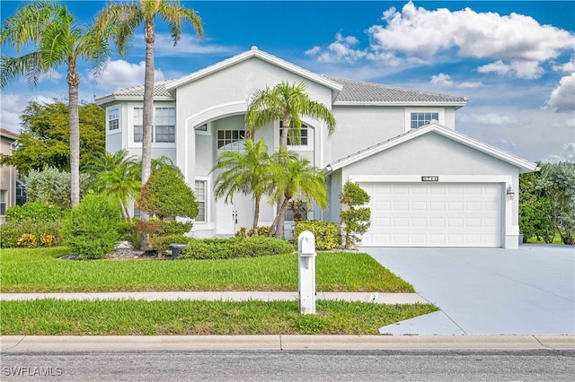 mediterranean / spanish-style home with a front yard