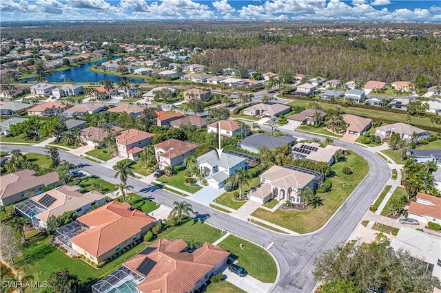 birds eye view of property featuring a residential view and a water view