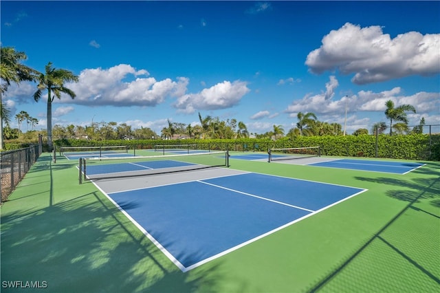 view of tennis court featuring fence