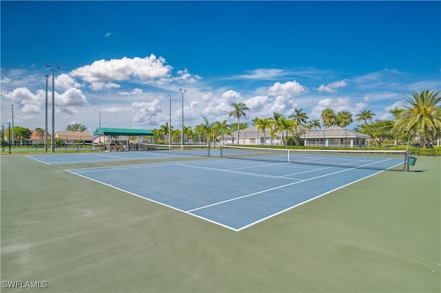 view of sport court featuring fence