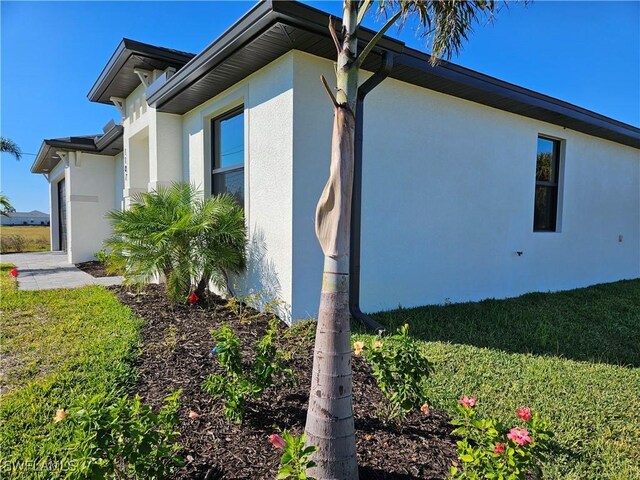 view of property exterior featuring a yard