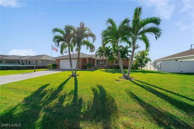 ranch-style house featuring a garage and a front lawn