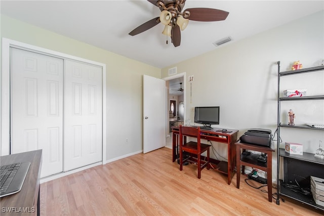 home office with ceiling fan and light wood-type flooring