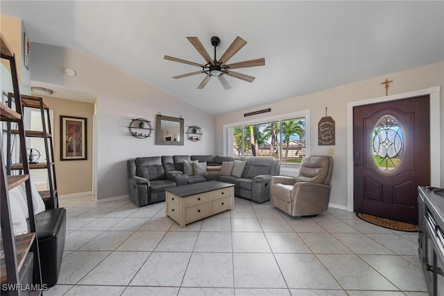 living room with ceiling fan, light tile patterned floors, and vaulted ceiling