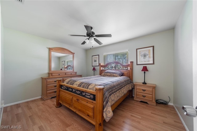 bedroom featuring light hardwood / wood-style floors and ceiling fan