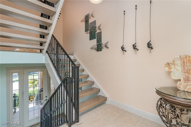 stairway featuring tile patterned floors