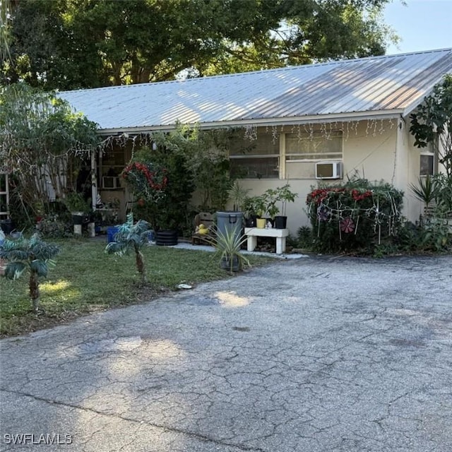 648 Carolina Ave, Fort Myers, FL 33905 - view of front of house featuring metal roof and stucco siding