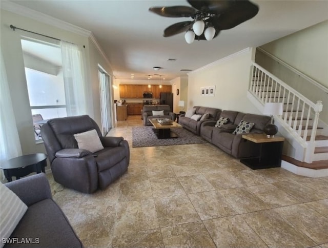 living room with ceiling fan and ornamental molding