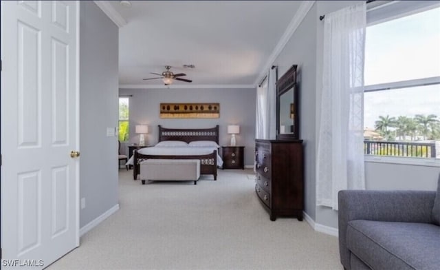 bedroom featuring crown molding, ceiling fan, and light colored carpet