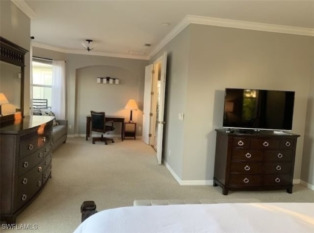 carpeted bedroom featuring crown molding