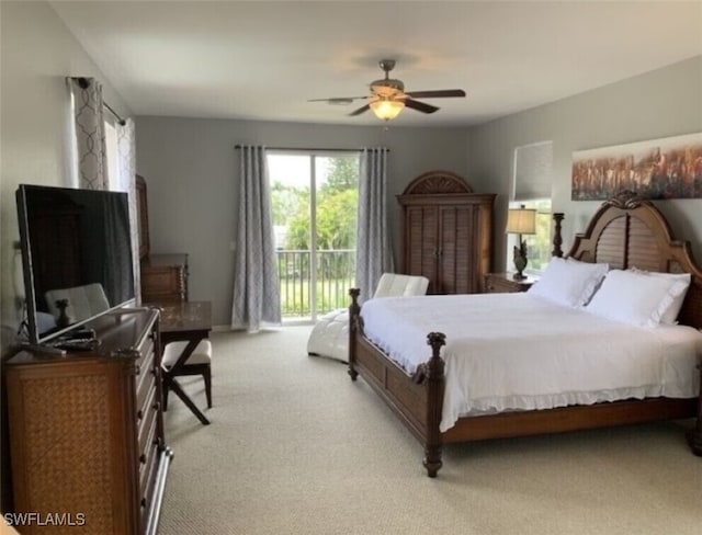 bedroom featuring ceiling fan, access to exterior, and light colored carpet