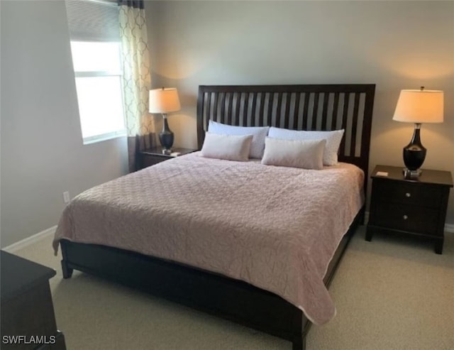 bedroom with light carpet