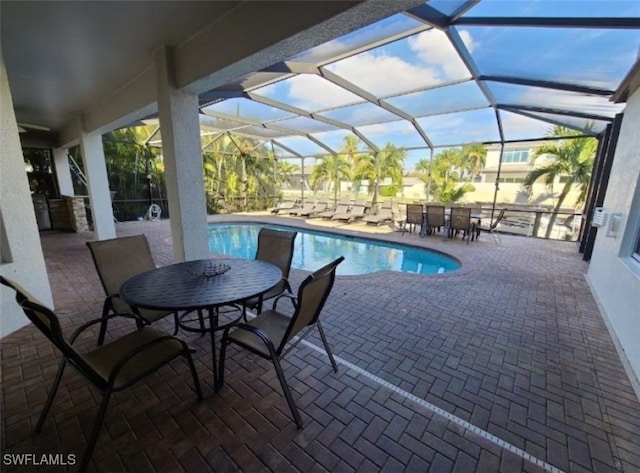 view of pool with a lanai and a patio