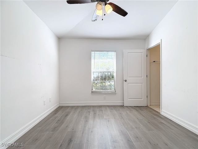 unfurnished room with light hardwood / wood-style flooring and ceiling fan