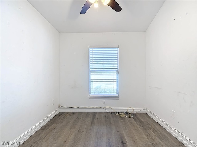 empty room featuring hardwood / wood-style floors and ceiling fan