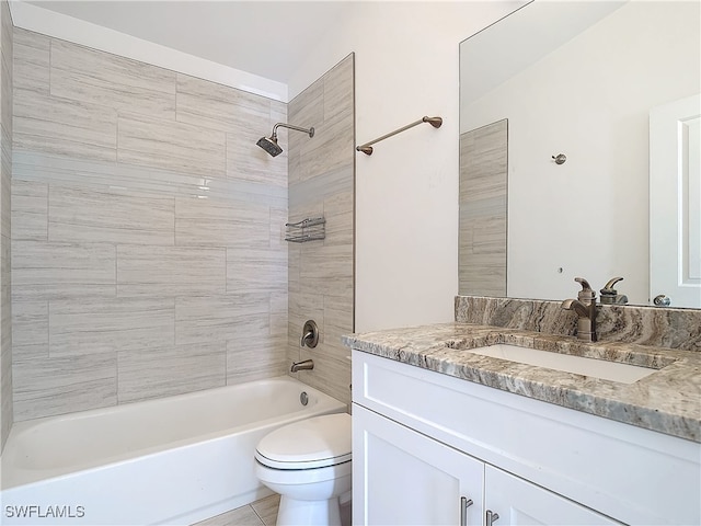 full bathroom with tile patterned floors, vanity, toilet, and tiled shower / bath