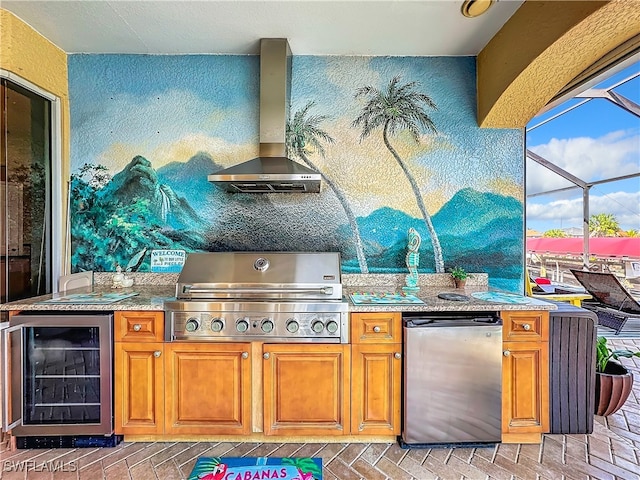 kitchen with wall chimney exhaust hood, beverage cooler, and appliances with stainless steel finishes