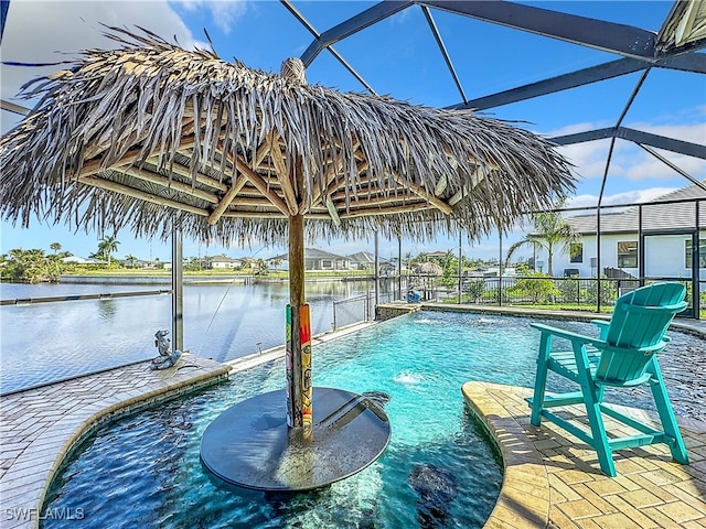 view of pool with pool water feature, a water view, and a lanai