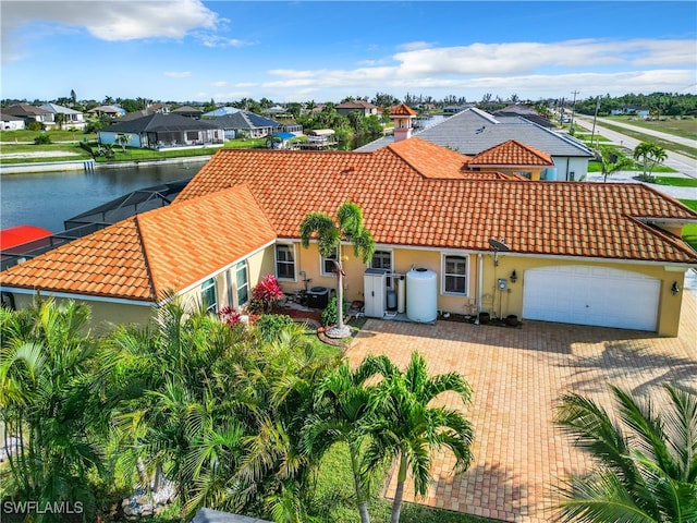 view of front of house with a water view and a garage