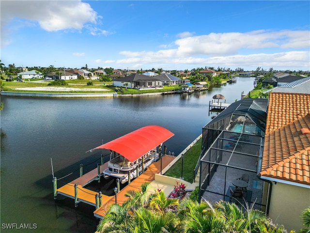 dock area featuring a lanai and a water view