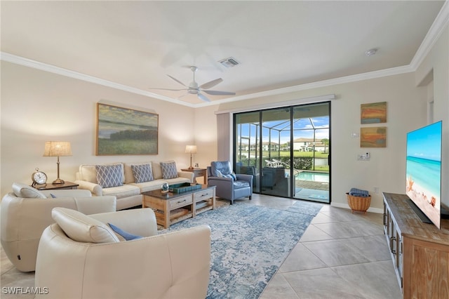 tiled living room with ceiling fan and ornamental molding