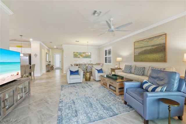 tiled living room with ceiling fan and ornamental molding