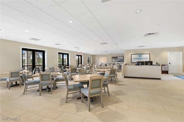 dining space featuring french doors