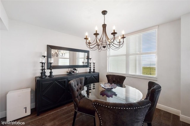 dining room with a chandelier and dark hardwood / wood-style flooring