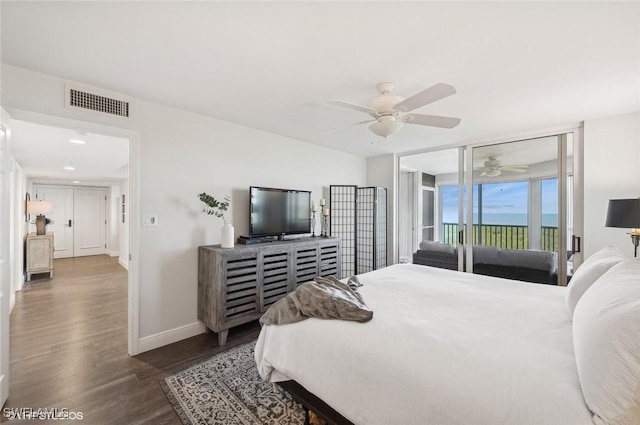 bedroom with access to outside, ceiling fan, and dark hardwood / wood-style floors