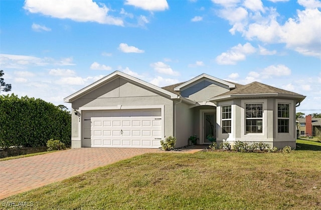 ranch-style house featuring a front lawn and a garage